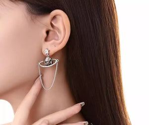 Asymmetric planet earrings