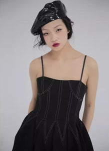 Patchwork waisted little black dress with suspenders