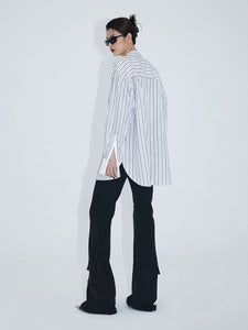 Minimalist waist asymmetric pocket flared pants