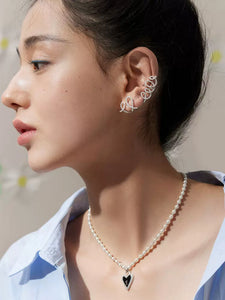 Solid silver light luxury fashion cream curl earrings