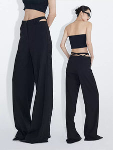 Black loose straight-leg suit pants with hollowed-out back waist