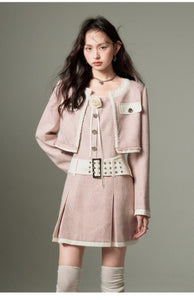 Maillard coat rose brooch Chanel style suit